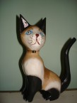 chat assis avec cloche