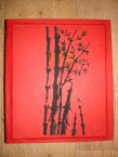 album de photos en papier fait artisanalement avec un bambou