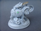 éléphant avec crapeau et un pièce de chance
