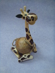 tirelire girafe assis