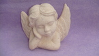 un ange en pièrre blanc